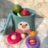 Premium teal woven storage hamper styled with colorful toys in luxury kids nursery
