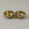 Handcrafted luxury brass kumkum set featuring two intricately carved solid brass bowls for puja